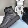 desc_prada-leather-and-shearling-hightop-sneakers_0