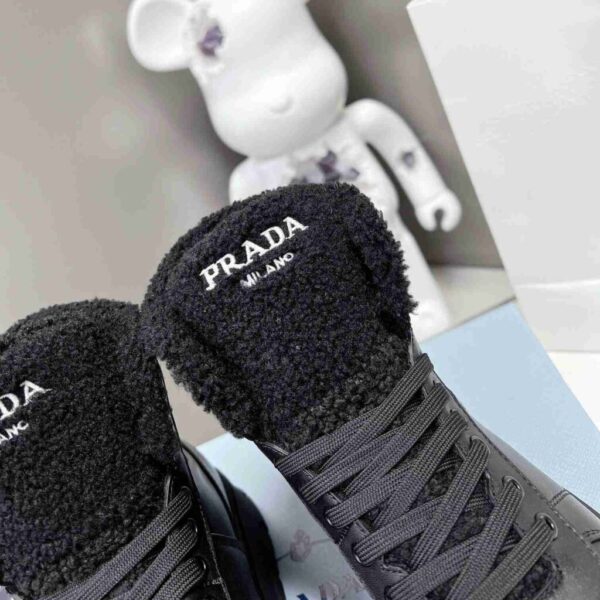 desc_prada-leather-and-shearling-hightop-sneakers_7